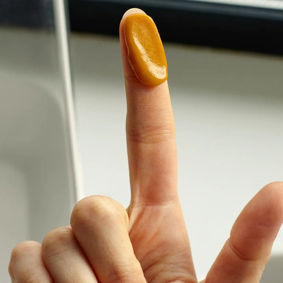 Pea-sized amount of cream on a fingertip