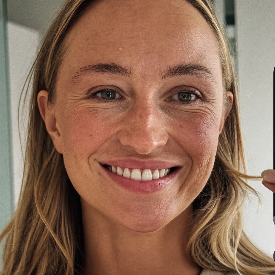 Woman smiling after completing her nighttime routine